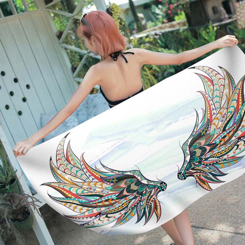 Rectangular beach towel with colorful digital print design, soft fabric texture visibly displayed