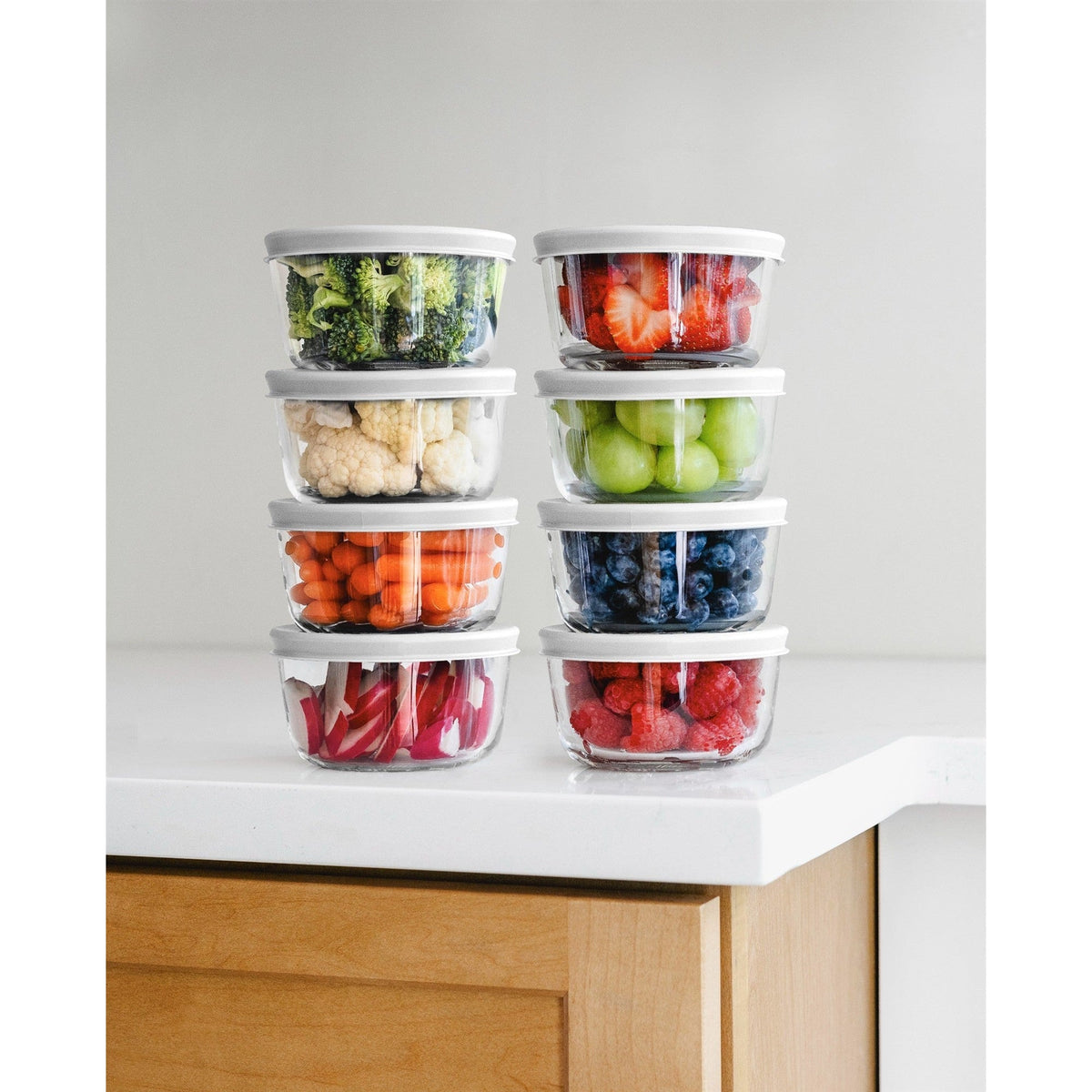 Set of 16 round glass storage containers with white lids, 1-cup (8 oz) capacity, by Dura Living, suitable for food storage.
