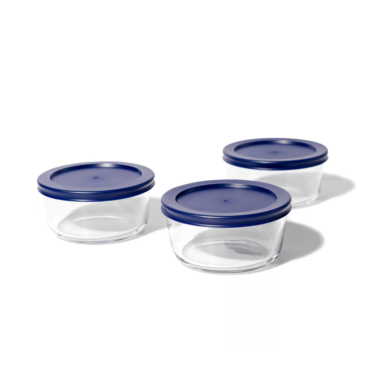 Six blue glass storage containers with lids, 16 oz round glassware set by Dura Living, featuring clear glass and matching blue lids.