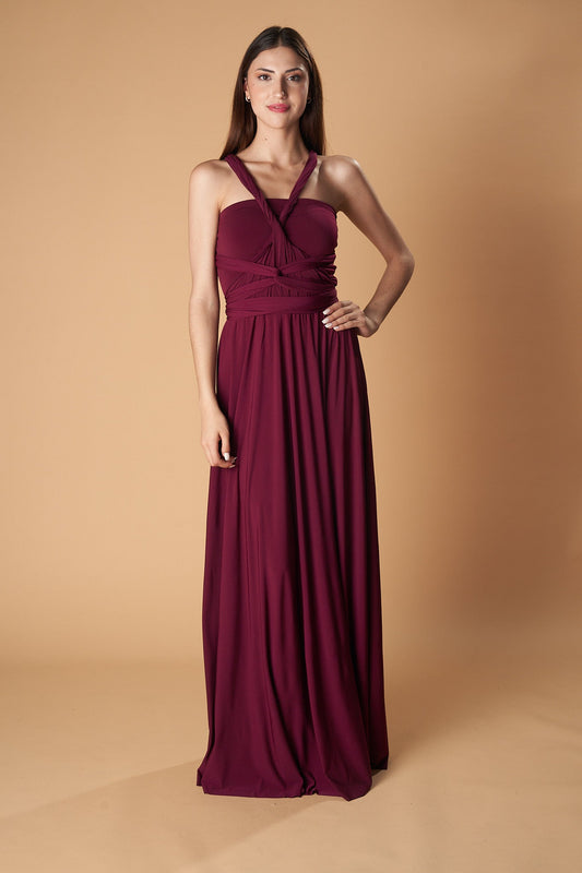 Ceylan Bcn multidress in vibrant fabric, sleeveless design with a flowing silhouette, displayed on a hanger.