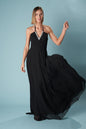Ceylan Bcn Monaco long dress in flowing fabric with elegant design, shown on a hanger against a neutral background.