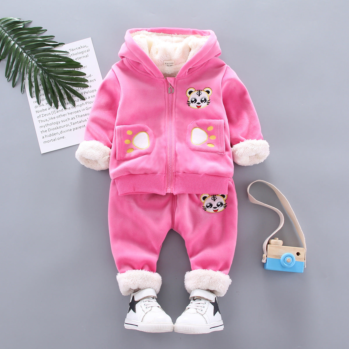 Golden mink plush winter clothing, soft textured fabric in a warm golden hue