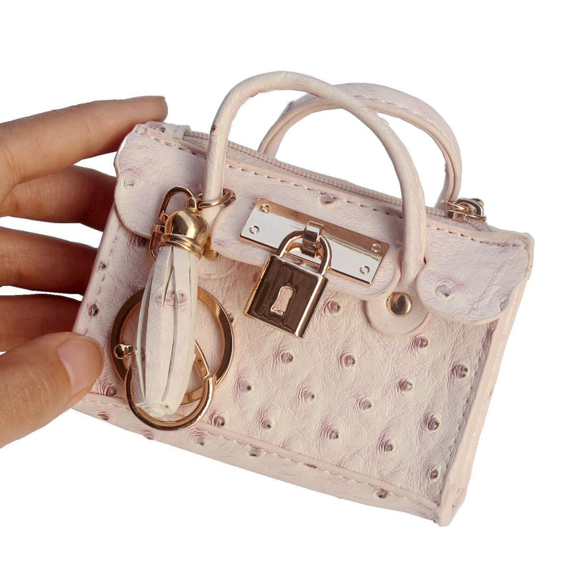 Leather solid color fashion tassel mini handbag with compact design and decorative tassel detail