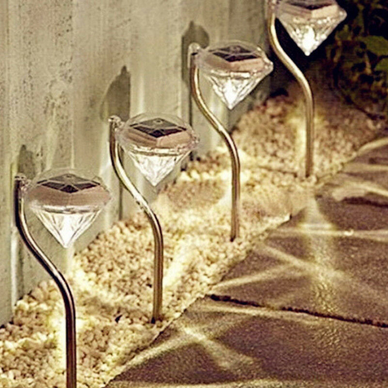 Solar powered garden diamond light with faceted crystal-style design and outdoor stake mount