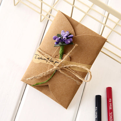 Kraft dried flower greeting card with creative botanical design