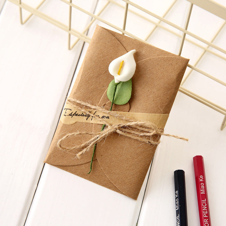 Creative kraft dried flower greeting card with natural botanical design and textured paper finish