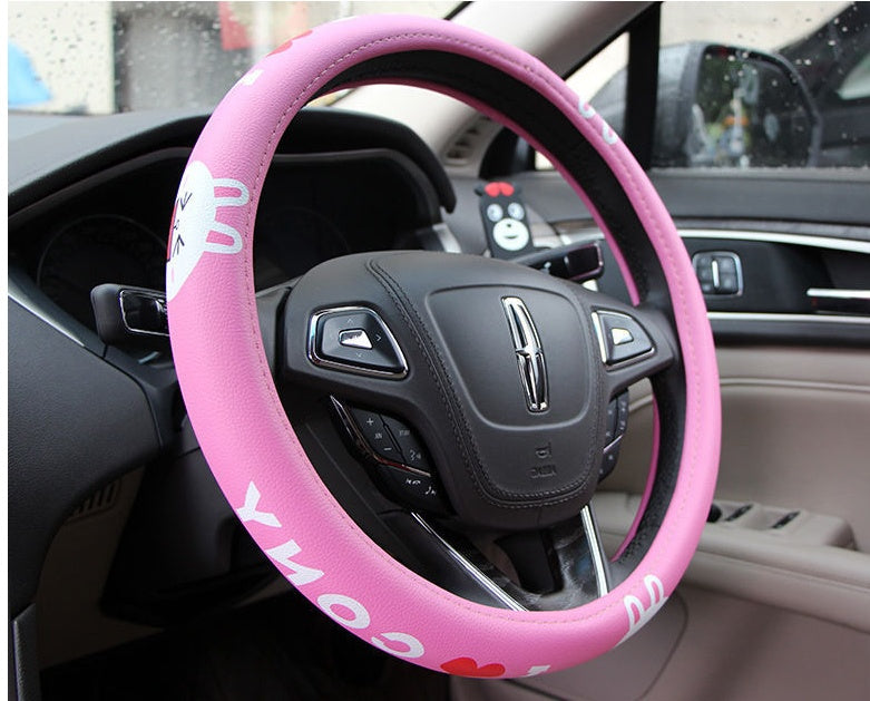 Cute Korean female steering wheel cover by My Store, pink character design on black cover
