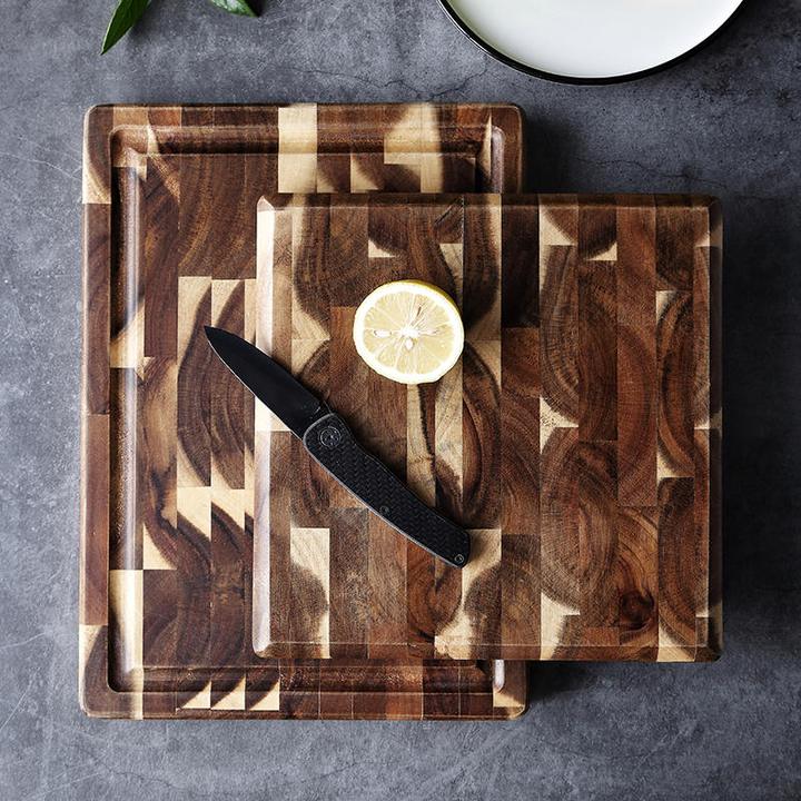 Parquet solid wood cutting board for kitchen household use, featuring a geometric wood grain design