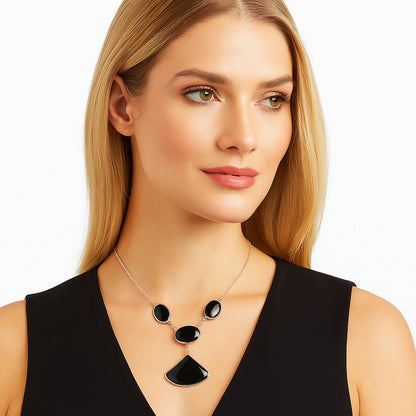 Sterling silver necklace with a black onyx pendant, styled with a sleek chain, by DESIRE GEM, model N-1013.