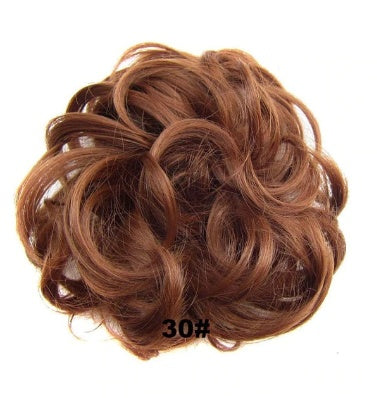 Gold hair ring accessory, close-up view