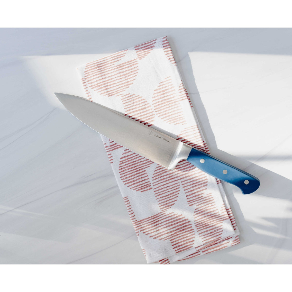 Dura Living Superior 3-Piece Kitchen Knife Set with Royal Blue handles, including chef’s, paring, and bread knives on a cutting board.