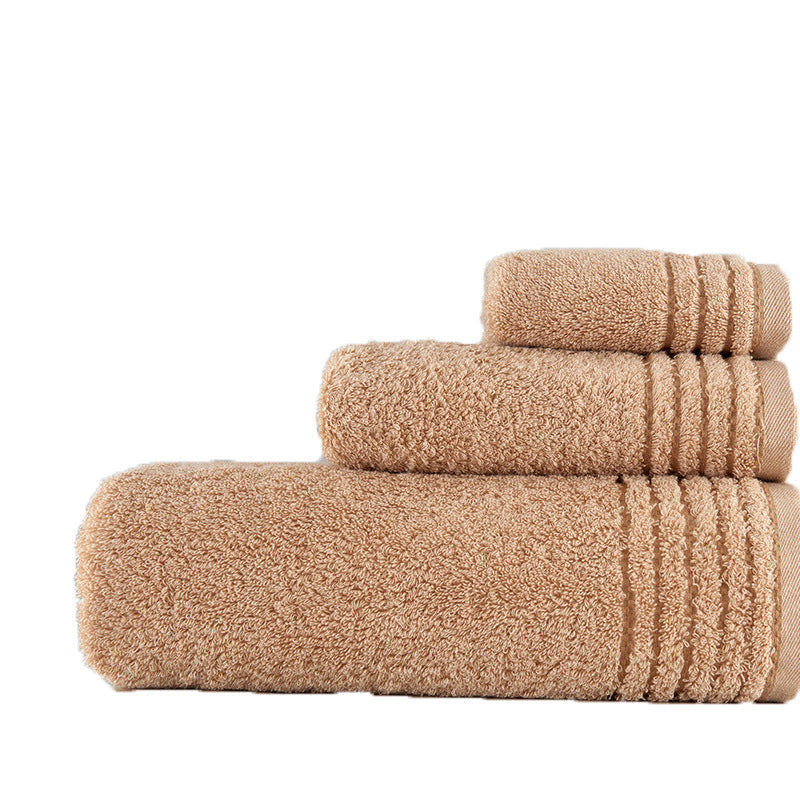 Cotton towel set folded neatly, soft textured fabric in assorted colors