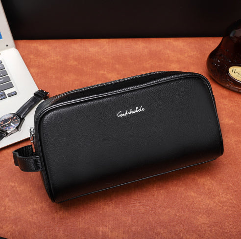 Men's leather clutch wallet handbag in black with zip closure and wrist strap
