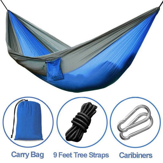 Portable nylon parachute double backpacking hammock suspended outdoors
