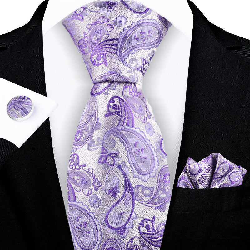 Jacquard-embroidered cashew flower tie with detailed floral pattern in rich fabric