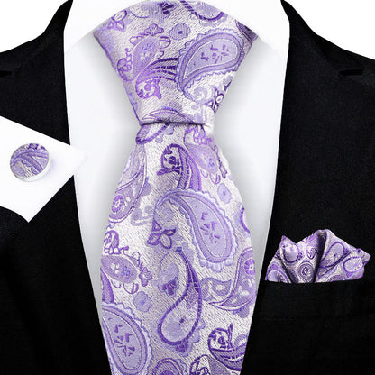 Jacquard-embroidered cashew flower tie with detailed floral pattern in rich fabric