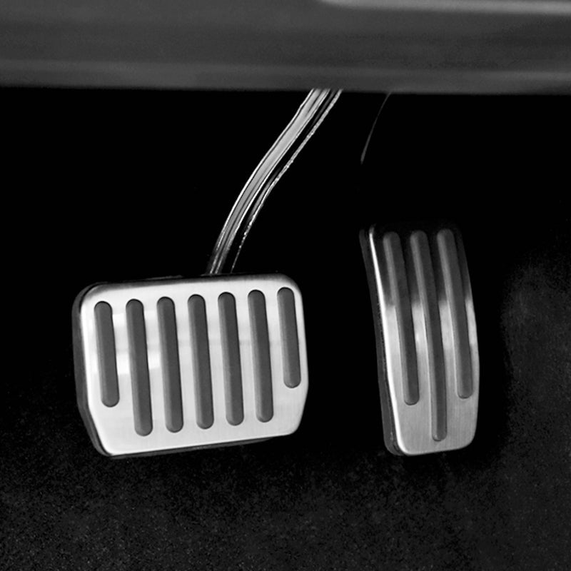 Stainless steel brake pedal, close-up view of polished pedal surface and mounting design