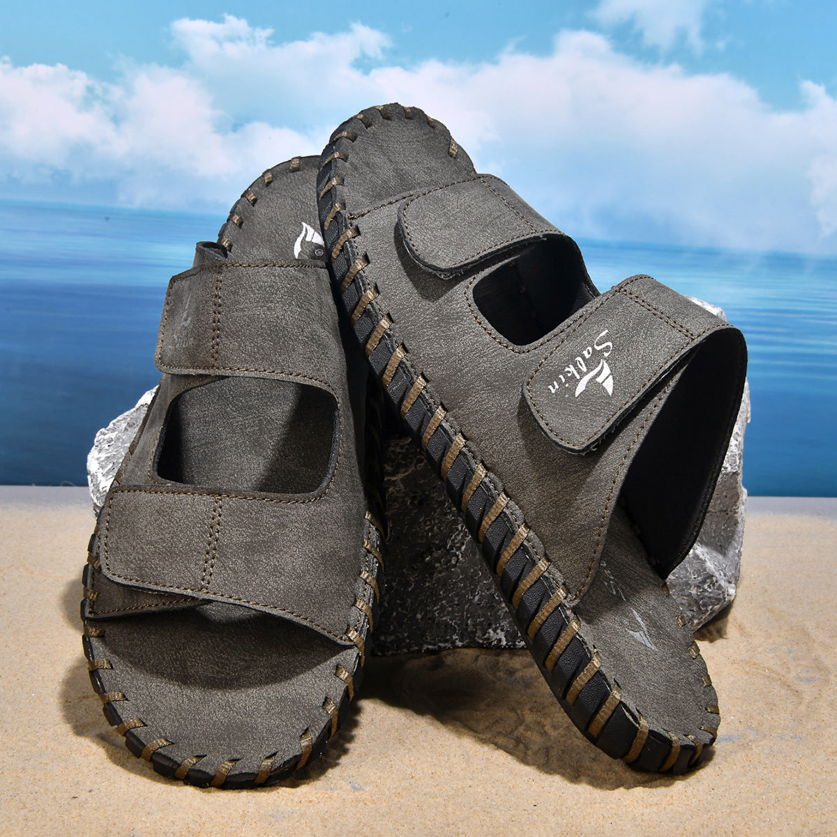 Men's casual outdoor leather slippers in a simple slip-on design, shown from the side on a white background