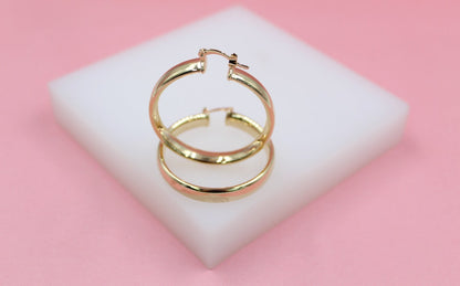18K gold filled 6mm thin lever back hoop earrings by MIA Jewelry, showcasing a sleek and elegant hoop design.