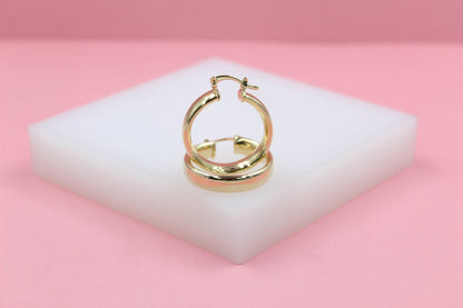 18K gold filled 6mm thin lever back hoop earrings by MIA Jewelry, showcasing sleek, polished gold hoops with secure clasp.