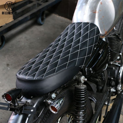 Retro modified diamond cushion for motorcycle seat, black diamond-pattern upholstery close-up