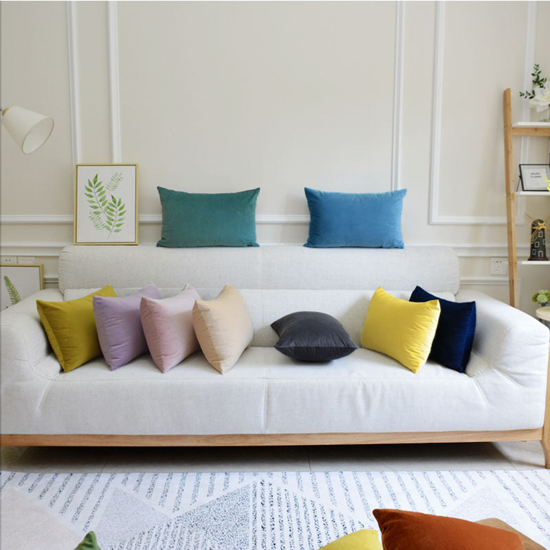 Velvet throw pillow for sofa in soft fabric, displayed in a simple product view