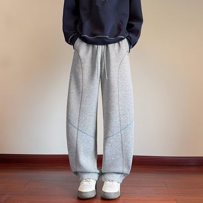 Men's cyan Scimitar bottom sweatpants with tapered legs and elastic waistband