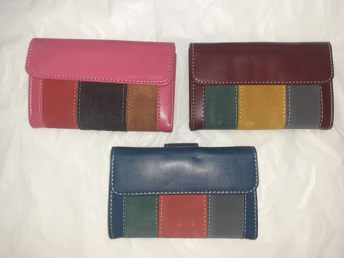 Handmade women's wallet with multiple card slots and a sleek design, featuring detailed craftsmanship and a compact size.