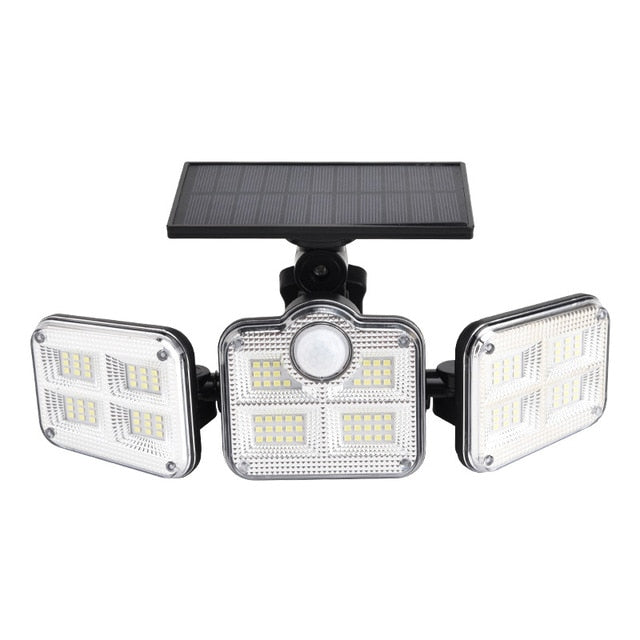 Solar wall light mounted on an exterior wall, featuring a compact weather-resistant design and integrated solar panel
