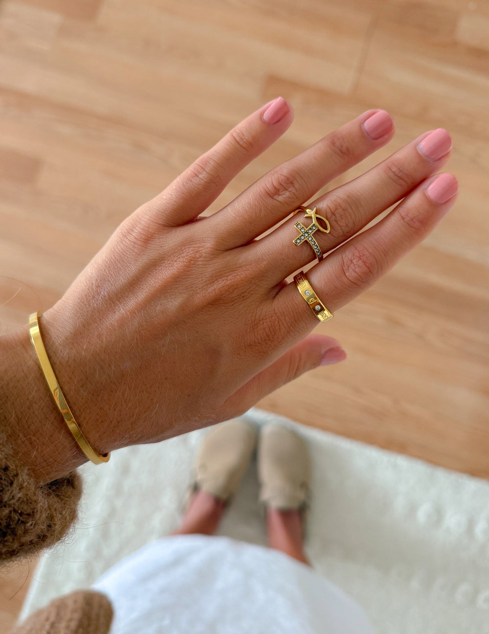 Elevated Faith gemstone logo ring featuring a colorful gemstone centerpiece and sleek band design.