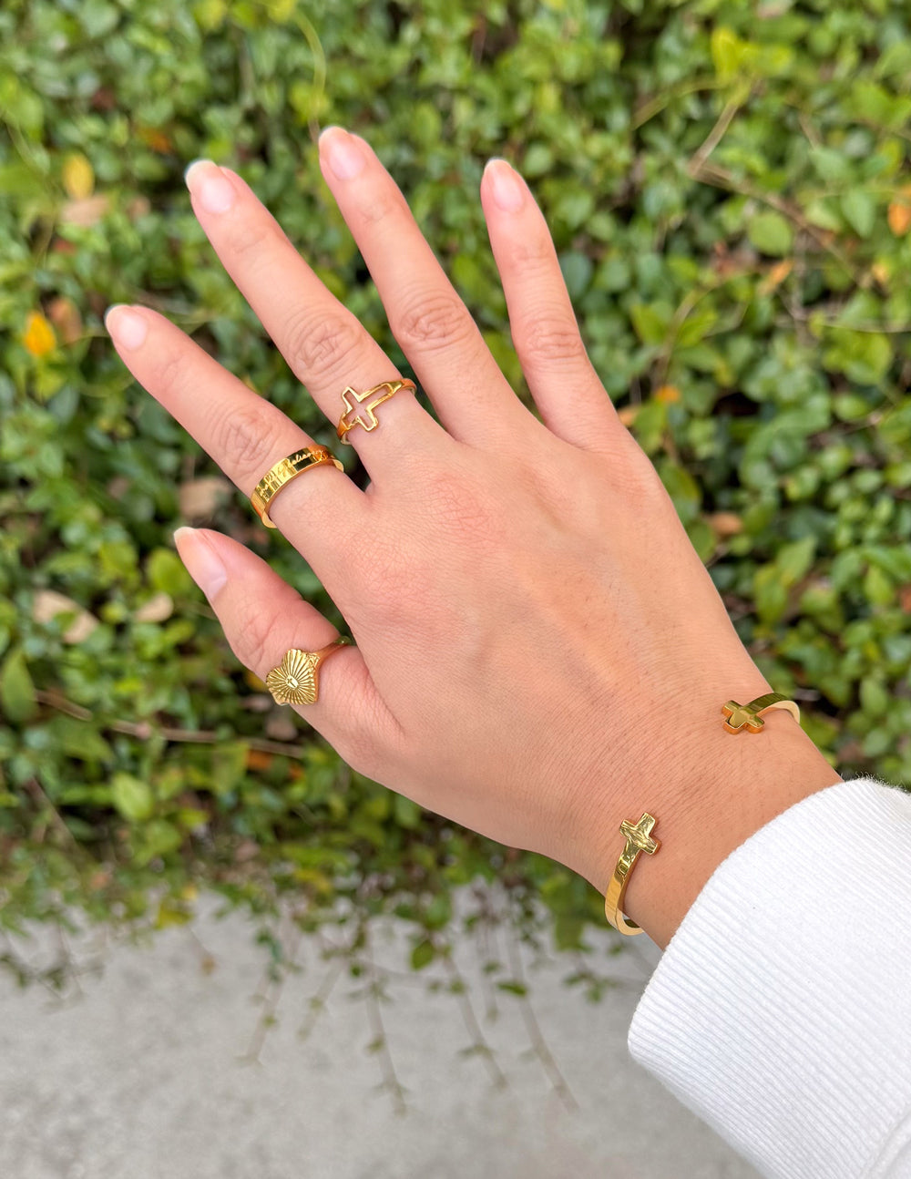 Elevated Faith Made by Believers ring featuring a sleek silver band with engraved religious symbols and a polished finish.