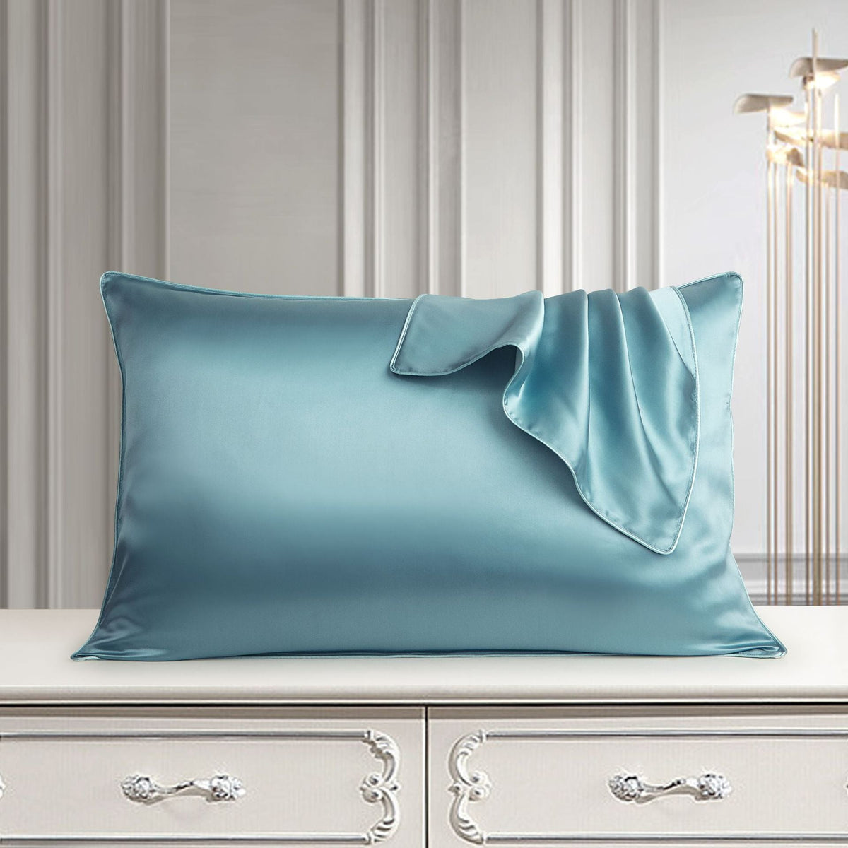 White pure silk pillowcase in close-up, showing smooth natural silk fabric and envelope closure