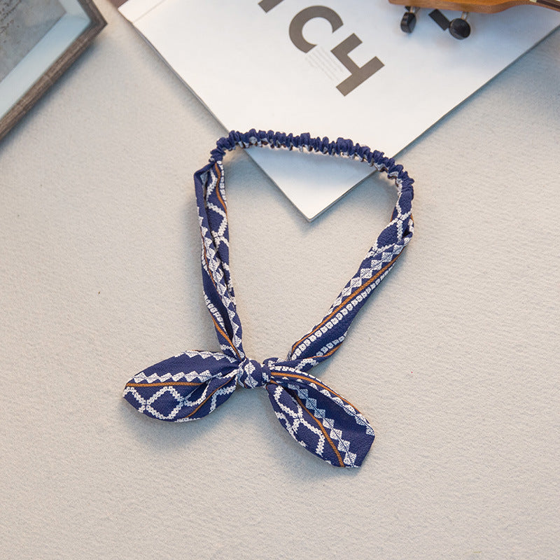 Big bow tie bunny ears headband with soft rabbit ears and oversized bow detail
