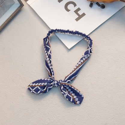 Big bow tie bunny ears headband with soft rabbit ears and oversized bow detail