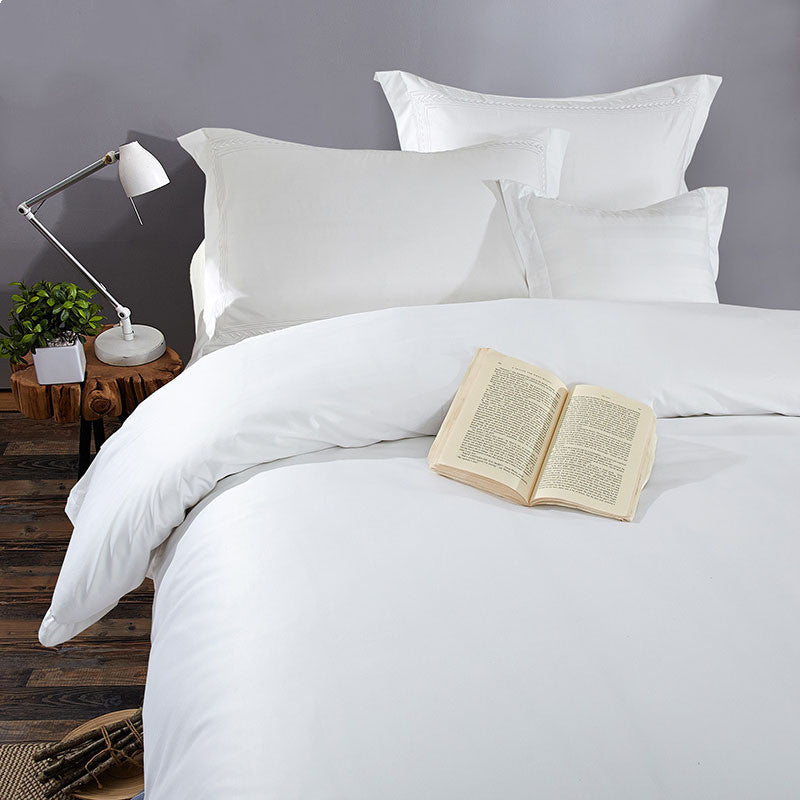 Cotton satin bedding set in a smooth, lustrous finish, displayed in a bedroom setting