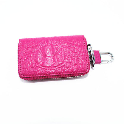 Black car key case with protective cover and key ring.