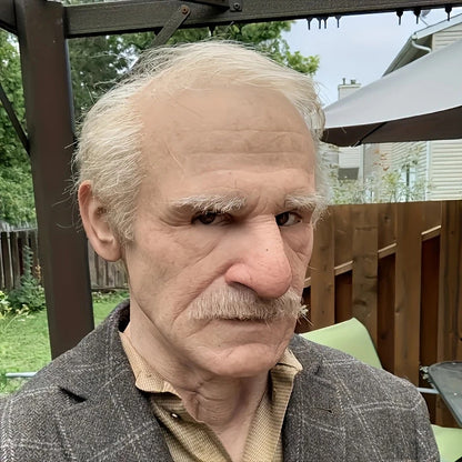 Old man Halloween mask with white hair, white beard, and headgear