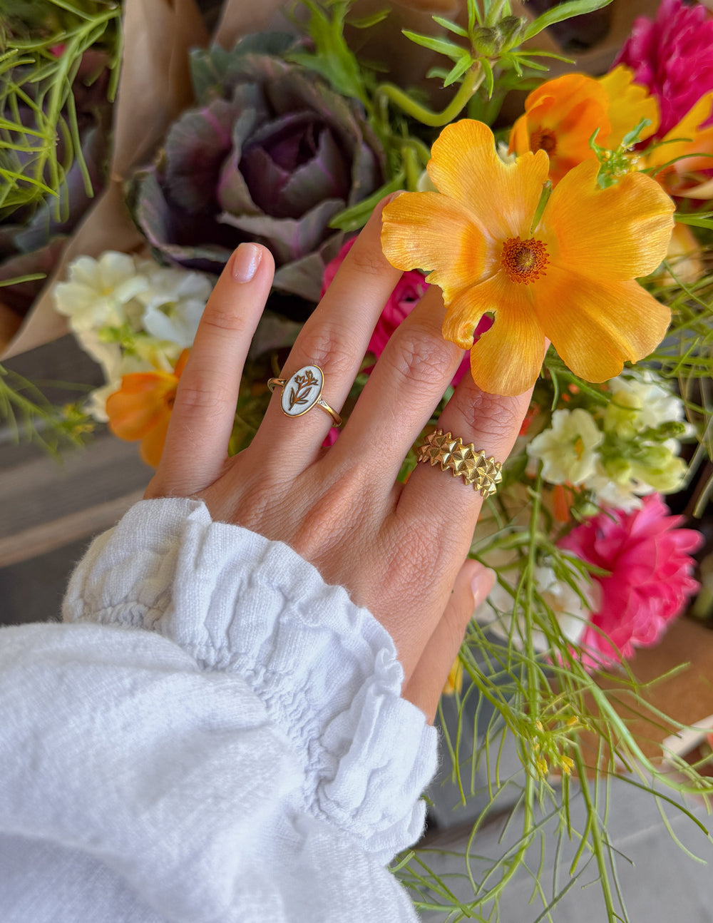 Elevated Faith Bloom Again enamel ring featuring a delicate floral design on a silver band.