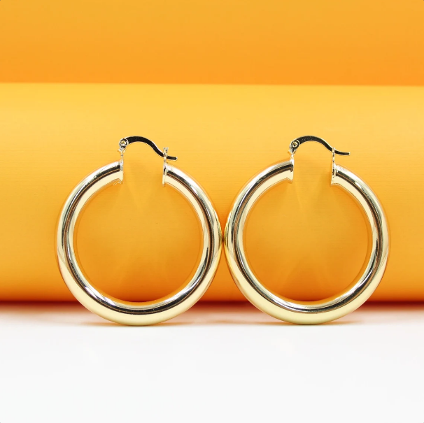 MIA Jewelry 18K gold-filled thick lever back hoop earrings and open hoop studs, showcasing shiny gold jewelry with a secure clasp