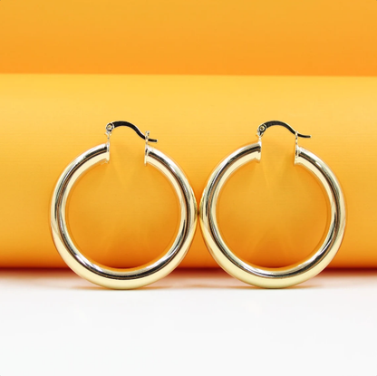 MIA Jewelry 18K gold-filled thick lever back hoop earrings and open hoop studs, showcasing shiny gold jewelry with a secure clasp