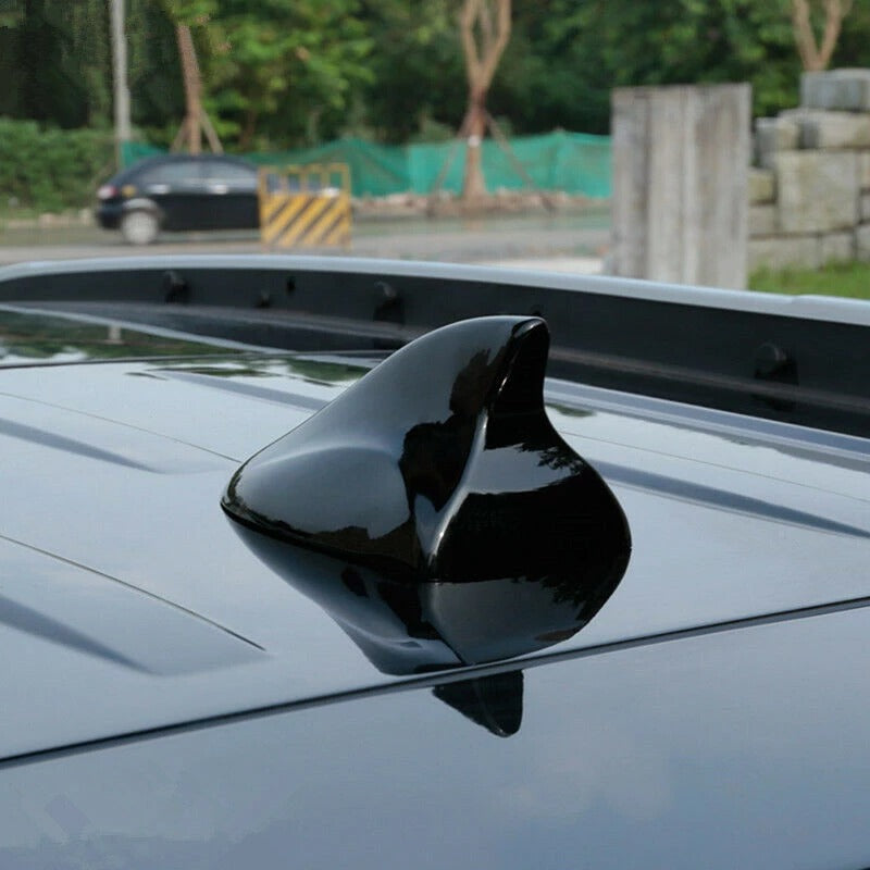 Black car shark fin antenna exterior view