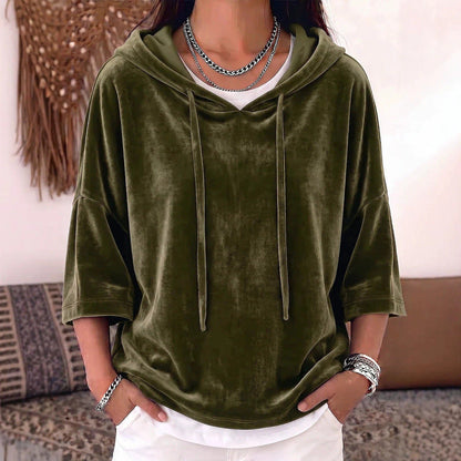Solid-color velvet hoodie with drawstring and three-quarter sleeves in a simple design