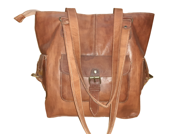 Handmade women's shoulder bag with adjustable strap, featuring a stylish, crafted design for everyday use.