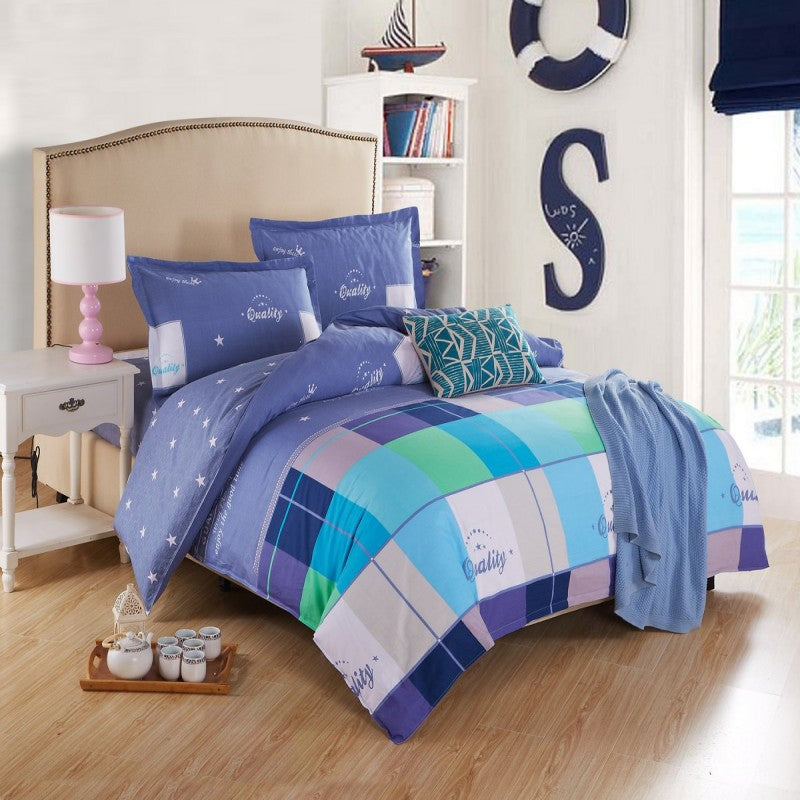 Four-piece cotton bedding set in soft home textile fabric, featuring a coordinated duvet cover and pillowcases