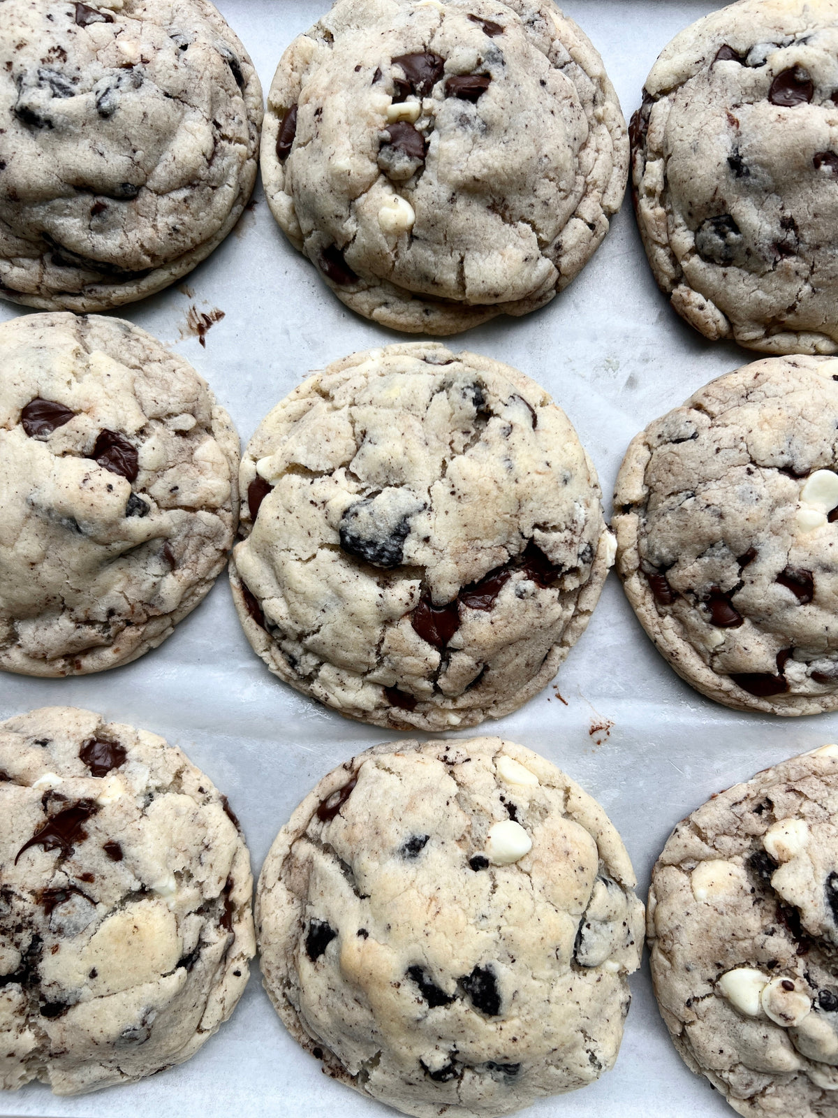 Cookies & Cream cookies from Let's Get Baked Artisan Desserts, showing freshly baked cookies with cookies and cream chunks.