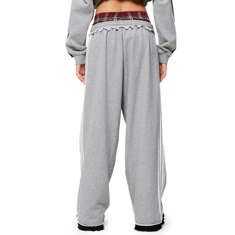 Retro striped embroidered athletic shorts with visible stripe detailing and embroidered design