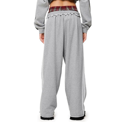 Retro striped embroidered athletic shorts with visible stripe detailing and embroidered design