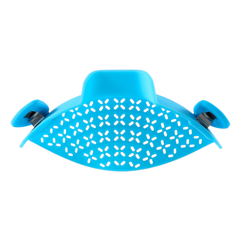 Silicone pot side drain stopper for kitchen gadgets, shown attached to a cooking pot rim