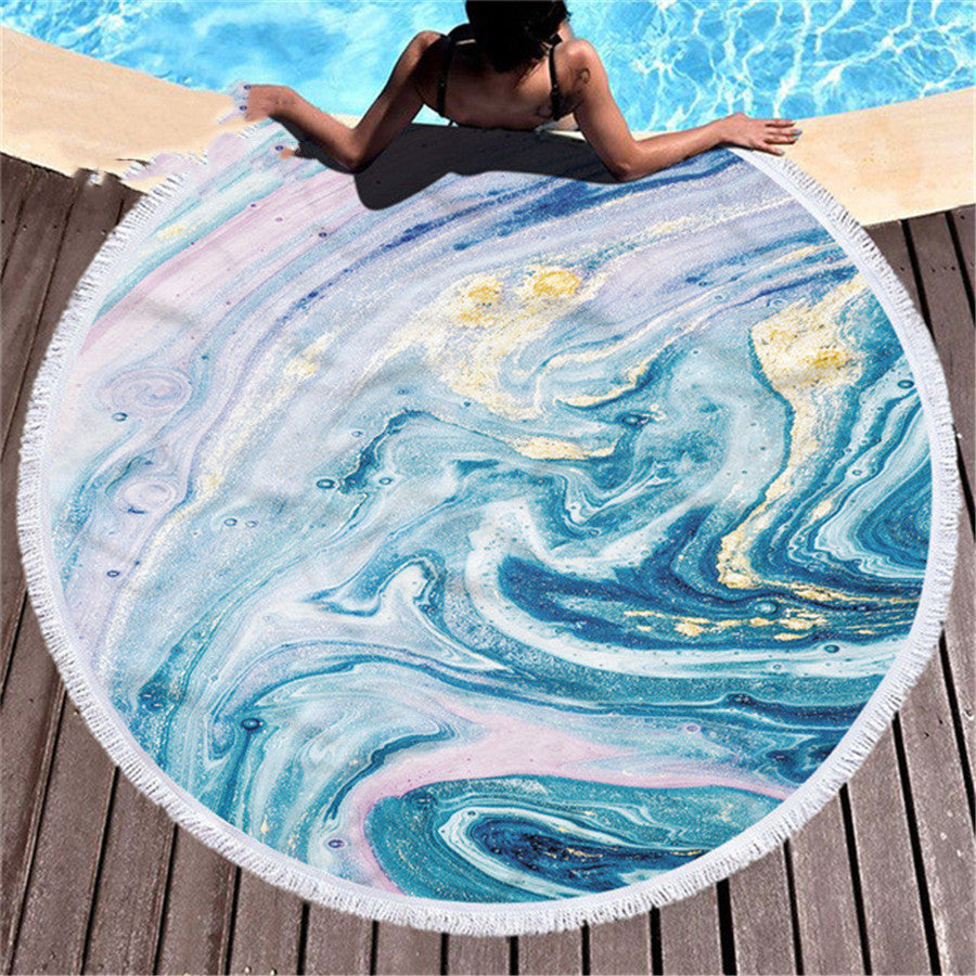 Marbling beach towel with abstract swirled pattern in blue, white, and gray tones