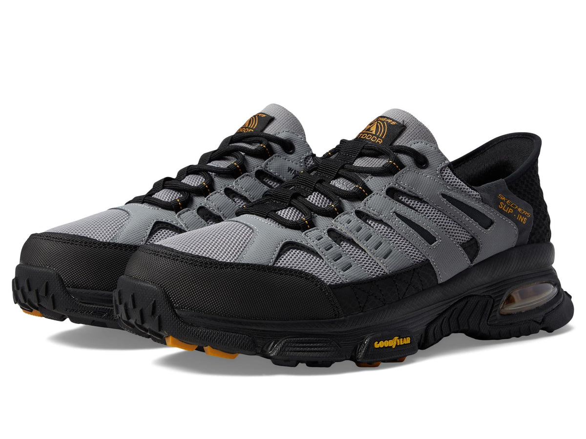 Skechers men's Air Envoy slip-on sneaker in gray and black, size 12W, featuring a casual design and breathable fabric upper.